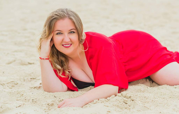 Plus size European blonde woman in stylish romantic women's summer clothes at beach. Concept of sizes, happy nice natural beautiful lady  - Foto, Bild