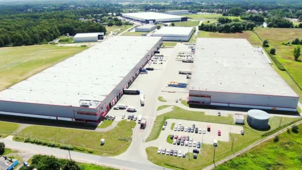 Aerial Shot of Truck with Attached Semi Trailer Leaving Industrial Warehouse / Storage Building / Loading Area Застрелений на Phantom 4K UHD Camera. - Кадри, відео