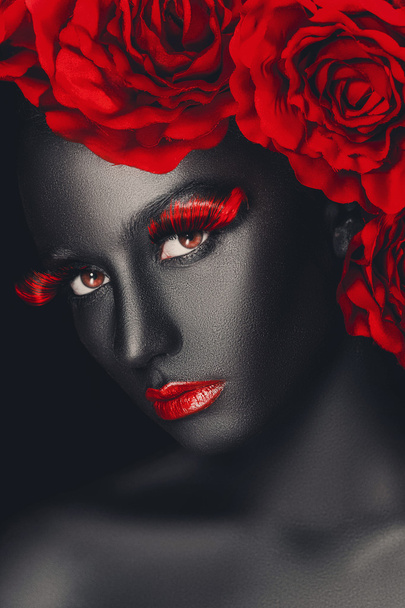 Close-up fashion portrait of a dark-skinned girl with color make-up - Фото, изображение