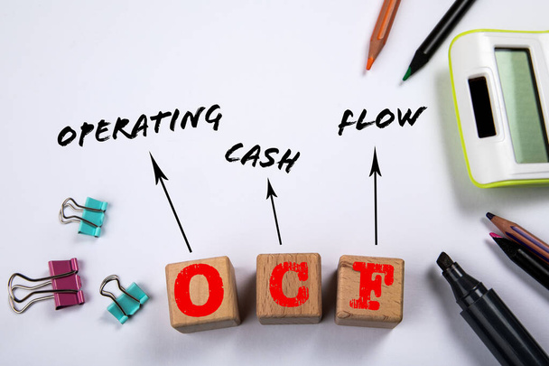 OCF - Operating Cash Flow. Wooden blocks on a white office table. - Foto, immagini