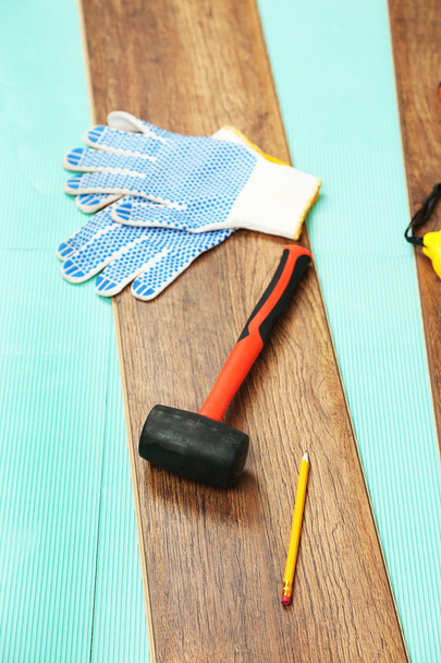 Carpenter tools on laminate floor - Fotó, kép