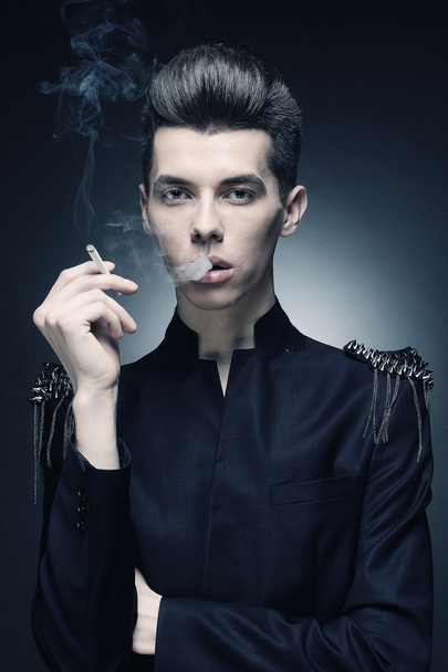 Young stylish man smoking a cigarette - Foto, Imagem