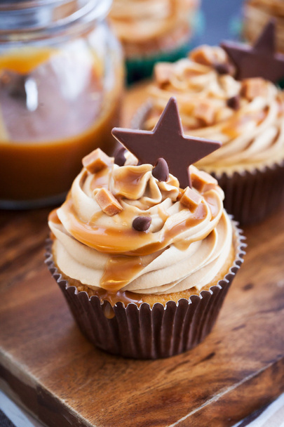 Cupcakes with cream cheese, caramel and chocolate - Photo, Image