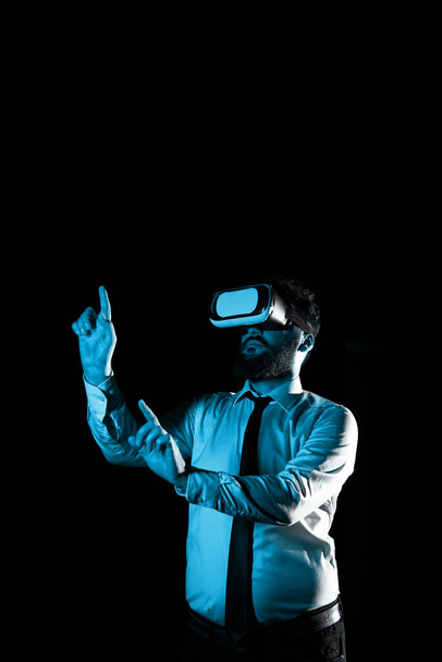 Man Wearing Vr Glasses And Pointing On Messages With one Finger and Pen. - Photo, image