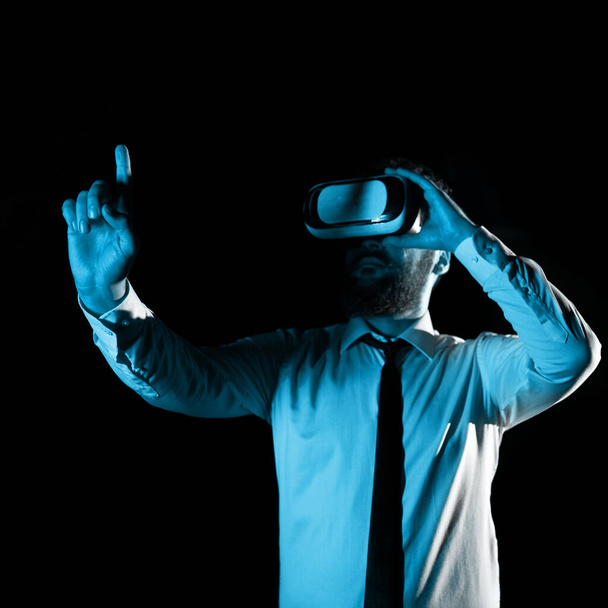 Man Wearing Vr Glasses And Pointing On Important Messages With One Finger. - Photo, image