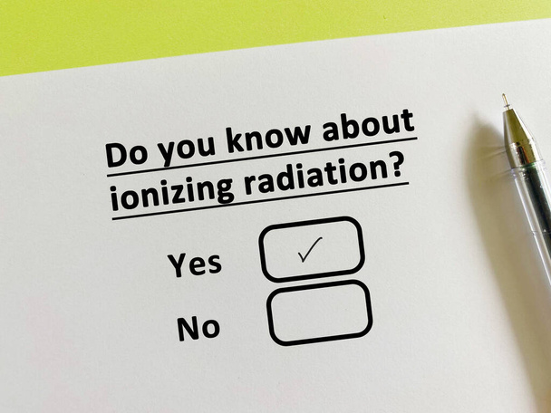 A person is answering question about food manufacturing. He knows about ionizing radiation. - Photo, image