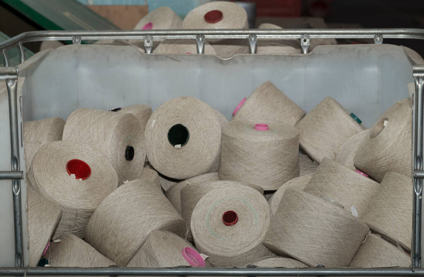 An old textile manufactory. Textile manufacturing. Bobbins with threads. - Fotó, kép