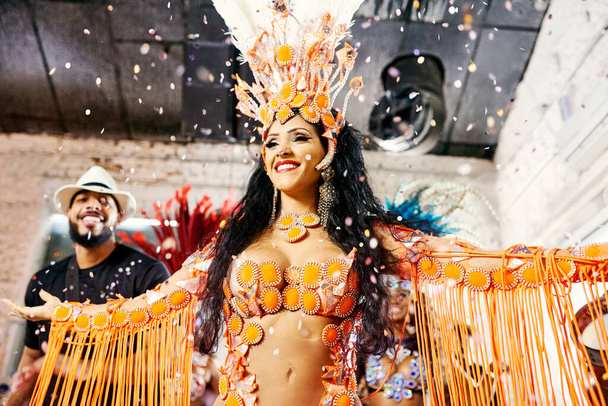 Samba, music and dance with woman at carnival for celebration, party and festival in Rio de Janeiro. Confetti, show and creative with brazil girl for performance, new year and culture event. - Photo, image