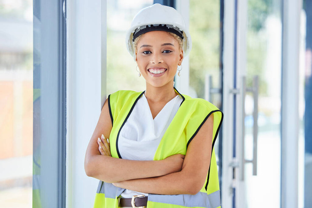 Portrait, construction worker or black woman in architecture for career vision, leadership and goals. Proud, happy and safety of an engineering person, manager or boss with office building mission. - Fotoğraf, Görsel