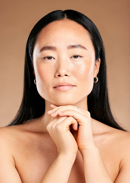 Beauty, portrait or face of Japanese woman or model in with glowing skin isolated on studio background. Tokyo, skincare or beautiful Asian girl with luxury facial treatment self care routine results. - Foto, imagen