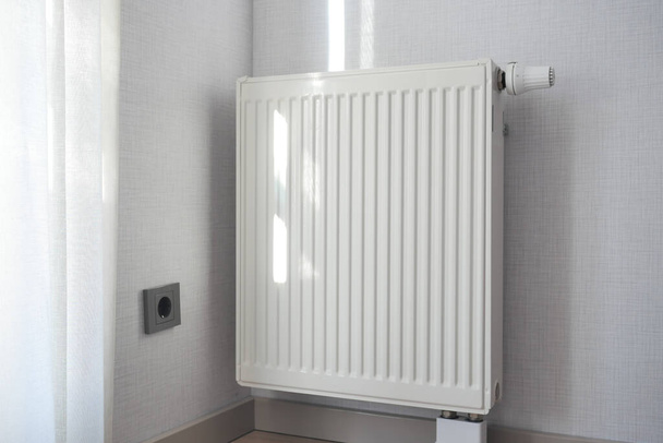 heating radiator under window in the room. High quality photo - Photo, Image