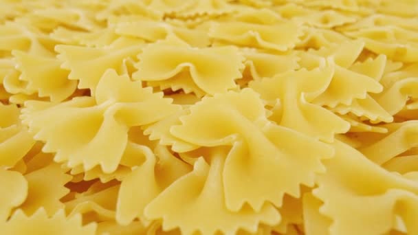 Pasta Farfalle or Bowtie pasta. Finest durum wheat pasta. Traditional Italian cuisine. - Metraje, vídeo