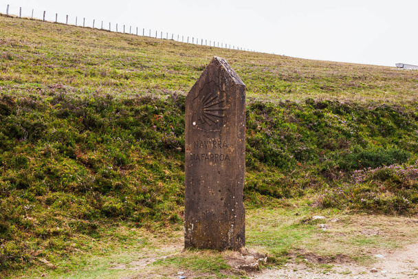 Pilgrimage Way Marking Stone Post with Scallop Shell Symbol in the Pilgrim Trail of the Way of St James or Camino de Santiago. French Pyrenees - Zdjęcie, obraz