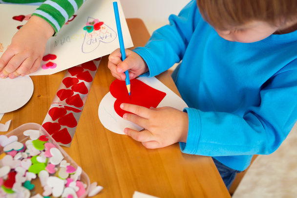 Kids engaged in Valentine's Day Arts with Hearts - Photo, image