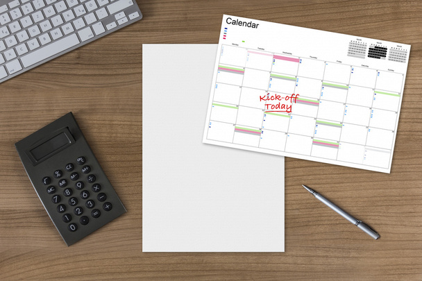 Calendar Kick-off blank sheet and calculator on wooden Table  - Photo, Image
