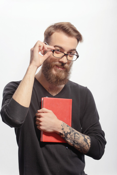Young creative man with a book - Valokuva, kuva