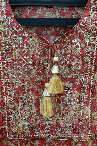   Close-up of Hande made disgn of indian woman fashion dress in display of shop                                - Fotó, kép