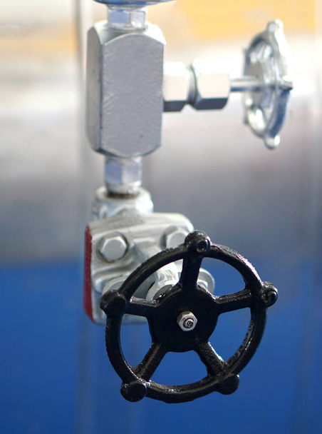  Close-up view of round handwheel in an industry                               - Foto, Bild