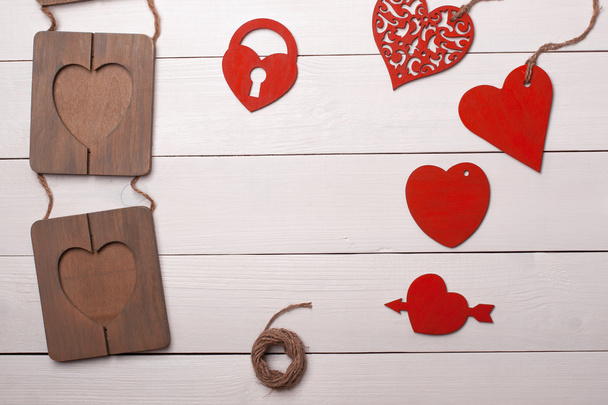 Heart and frame on the wooden table. Valentine's Day. Art - Photo, Image