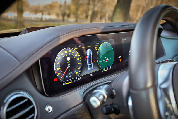 Car steering wheel with car dashboard computer and interior background, modern city car elements close view. Car inside interior - Zdjęcie, obraz