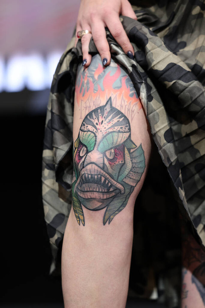 Krakow, Poland - June 11, 2022: Unidentified participant during the contest for the best tattoo at the 15th Tattoofest Convention in Cracow. One of the most prestigious tattoo festivals. - Photo, Image