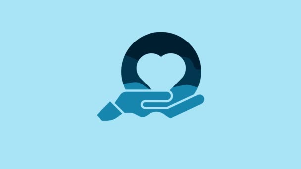 Blue Heart on hand icon isolated on blue background. Hand giving love symbol. 4K Video motion graphic animation. - Felvétel, videó