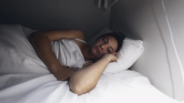 Woman going to sleep shutting off night lamp. Person turns OFF light - Felvétel, videó