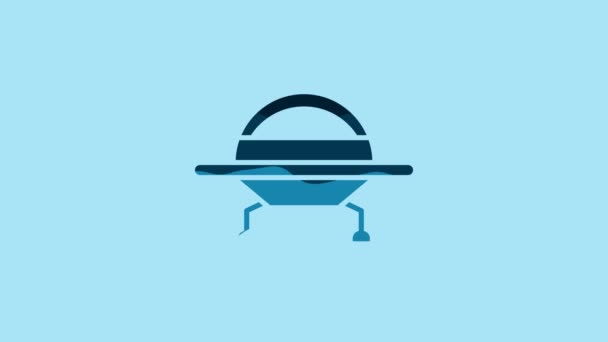 Blue UFO flying spaceship icon isolated on blue background. Flying saucer. Alien space ship. Futuristic unknown flying object. 4K Video motion graphic animation. - Materiał filmowy, wideo