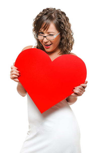 Young woman holding red heart - Valokuva, kuva