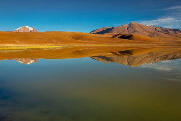 Salt lake Lejia reflection and idyllic volcanic landscape at Sunset, Atacama desert, Chile - Zdjęcie, obraz