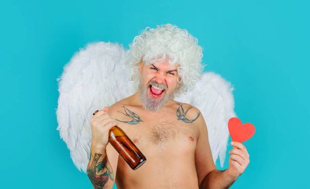 Valentines day. Naughty drunk cupid in angel wings with beer bottle and paper heart. Valentine card - Fotoğraf, Görsel