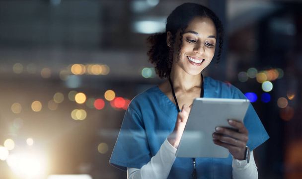 Medical, research and night with doctor and tablet for planning, medicine and schedule. Technology, review and digital with black woman reading report for healthcare, science and life insurance news. - Foto, Imagem