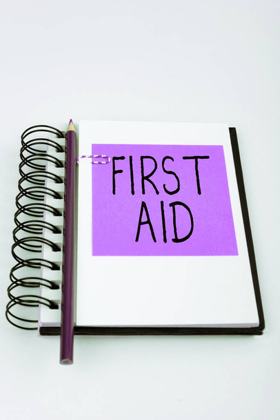 Handwriting text First Aid, Word for Practise of healing small cuts that no need for medical training - Photo, image