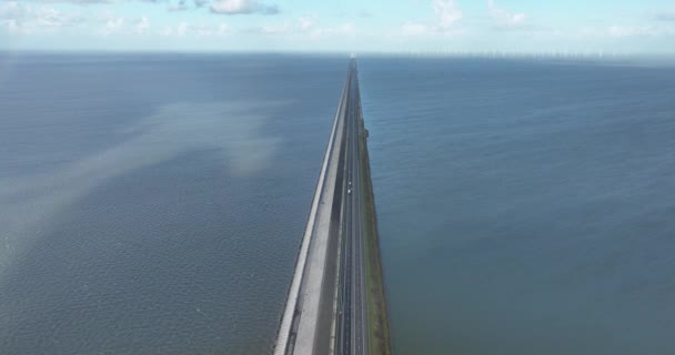 Spectacular drone footage of the Afsluitdijk, capturing the stunning dike and its beautiful surroundings, showcasing the breathtaking landscape, windmills, and historic cultural heritage - Кадры, видео