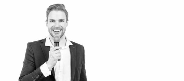 Happy man in business formalwear speak into microphone giving speech isolated on white, conferencier. Man face portrait, banner with copy space - Photo, Image