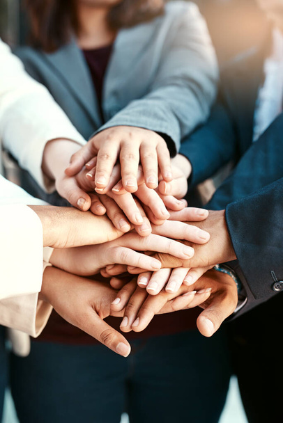 Nothing is stronger than teamwork. a group of unrecognizable peoples hands - Foto, Bild
