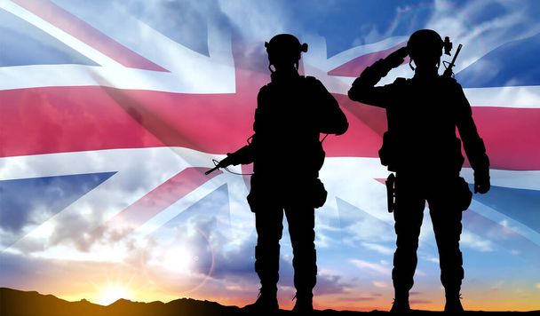 Silhouettes of a soldiers with United Kingdom flag on background of sky. Background for Remembrance Day. United Kingdom Armed Forces concept. EPS10 vector - Vetor, Imagem