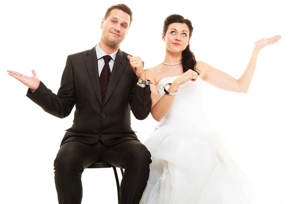 Bride and groom with handcuffs - Foto, imagen