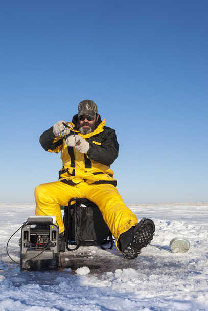 Pesca sobre hielo
 - Foto, Imagen