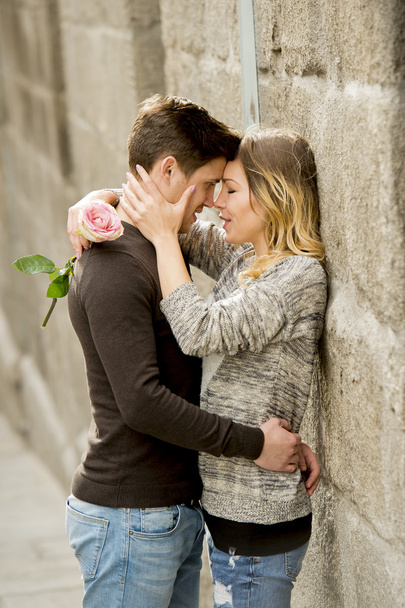 beautiful couple in love kissing on street alley celebrating Valentines day - Photo, Image