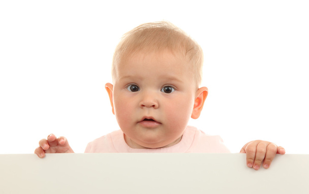 Cute baby girl holding empty white board - Foto, afbeelding