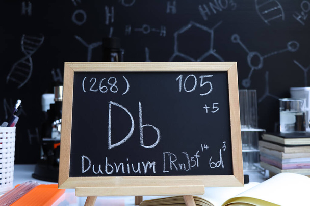 Dubnium and symbol structural formula chemical on the blackboard, Chemistry in the classroom - Valokuva, kuva