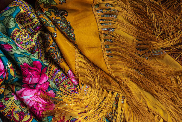 Colorful Boho flowers fabric. Fashionable collection of accessories for women. Detail of wardrobe - 写真・画像
