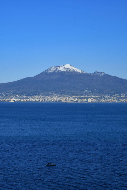 The Vesuvius volcano stands out over the gulf of Naples. Landscape from the town of Vico Equense. - Фото, зображення