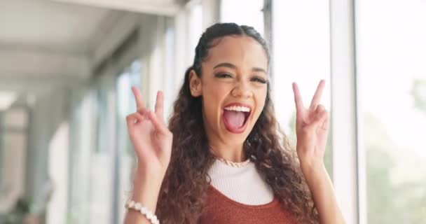 Success, face and creative woman with a peace sign walking in the office with carefree, cool and goofy pose. Happy, smile and professional female from Mexico with chill hand gesture in the workplace - Filmmaterial, Video