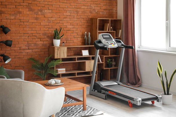 Interior of living room with modern treadmill - Photo, image
