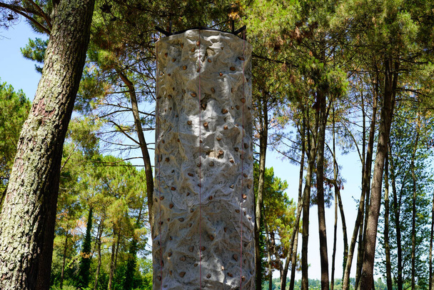artificial climbing wall in city forest outdoors rock climb wall background - Foto, immagini