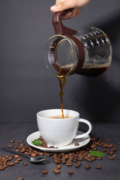 creative concept photo of coffee beans and coffee cup - Fotografie, Obrázek