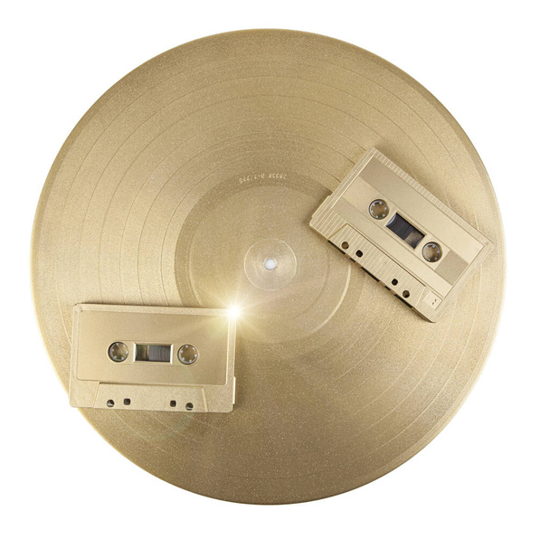 Vinyl record and cassette tape. - Фото, изображение