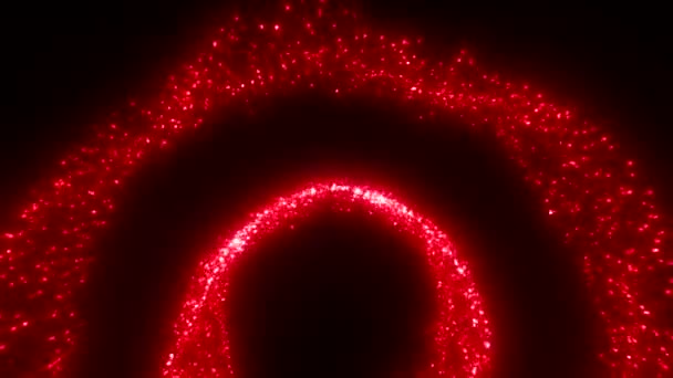 Abstract shimmering particles creating shape of arcs and circles. Motion. Fluctuating glowing dots on a black background  - Footage, Video